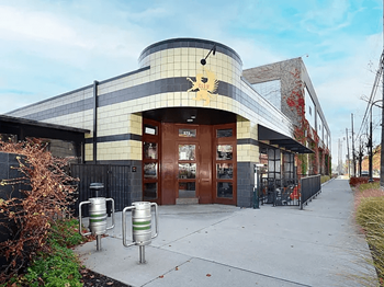 Griffin claw with a curved facade and a large mural